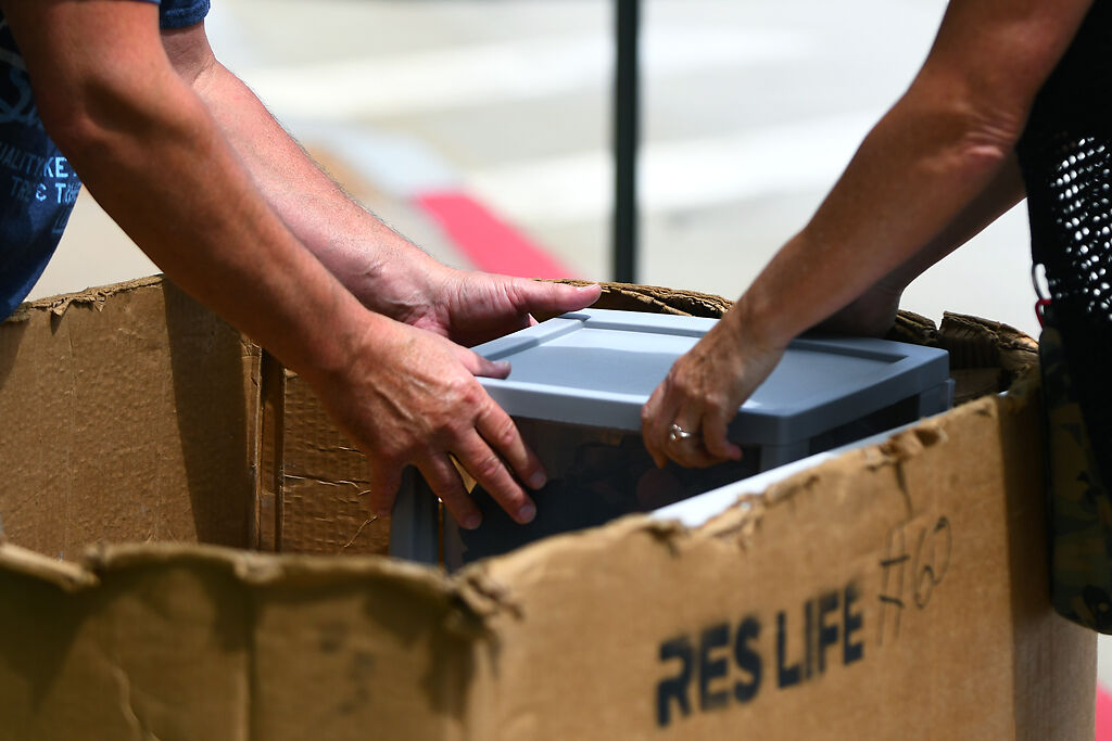 Mark Bommarito and Sheri Bommarito put their daughter, Skylar Bommarito’s plastic box
